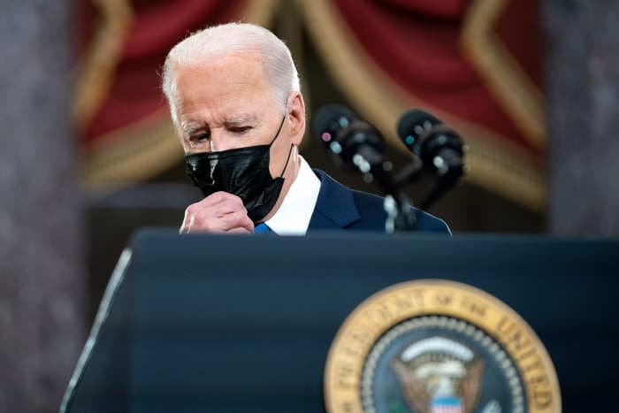 As Omicron surges, Biden shifts his message to urge Americans to learn to live with COVID
