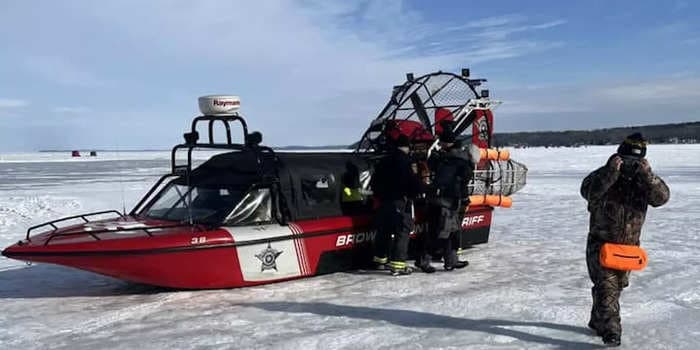 Photos show 34 people being rescued after a chunk of ice broke away and drifted 1 mile into a Wisconsin lake