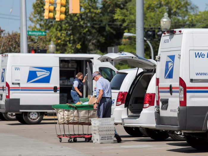 Biden officials are trying to stop the Postal Service from spending $11.3 billion on gas-powered trucks, citing pollution and climate change