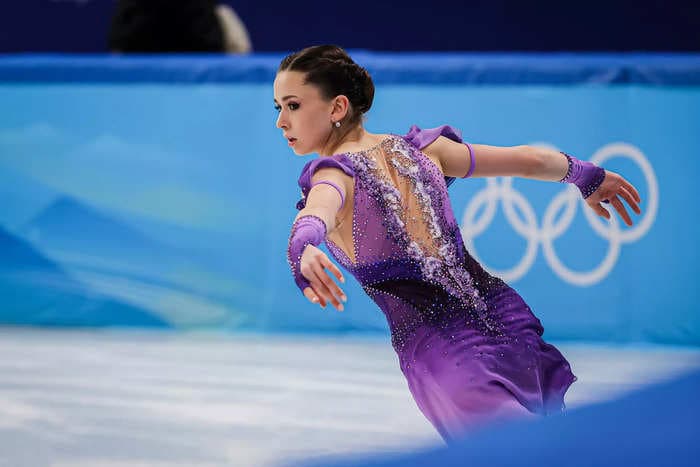 The 15-year-old Russian skater who tested positive for a banned substance remains free to compete in Beijing for now