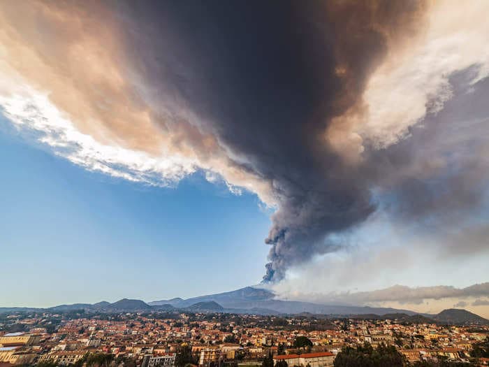 Mount Etna's eruption launched a massive cloud of ash nearly 8 miles into the sky in Italy