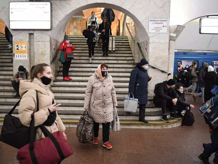 Crowds of Ukrainian people are hiding from airstrikes in subway station