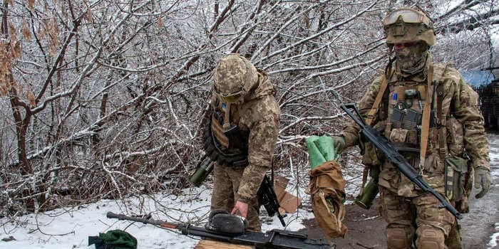 Away from Ukraine's worst conflict zones, people gather to make camo nets for the army and bandages for the wounded