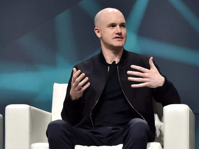 Coinbase CEO Brian Armstrong says crypto is a lifeline for regular Russians, and the exchange won't ban them unless the law tells it to