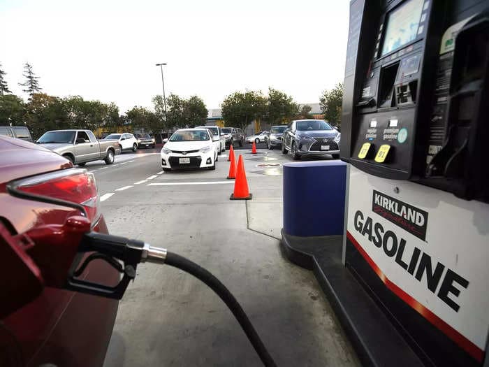 Long lines build up outside Costco and Sam's Club gas stations as shoppers load up on cheaper gas amid further price spikes