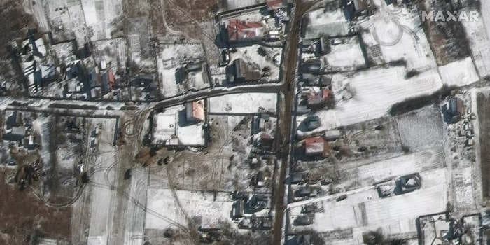 Satellite images show a large Russian military convoy deployed near a Ukrainian airport northwest of Kyiv