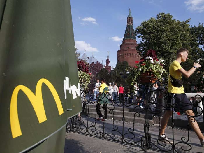 Why McDonald's, Burger King, and Papa John's can't just close all their stores in Russia