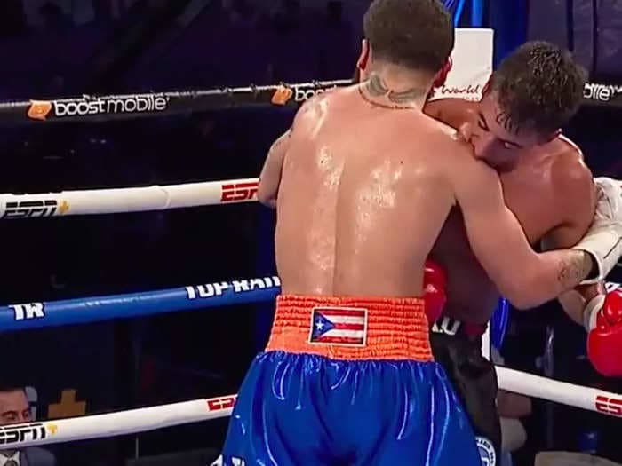 A boxer scored 2 knockdowns but risked disqualification when he bit his opponent for no apparent reason at all