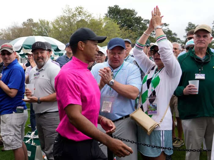 Tiger Woods is so popular that hundreds of people gathered to see him leave a bathroom