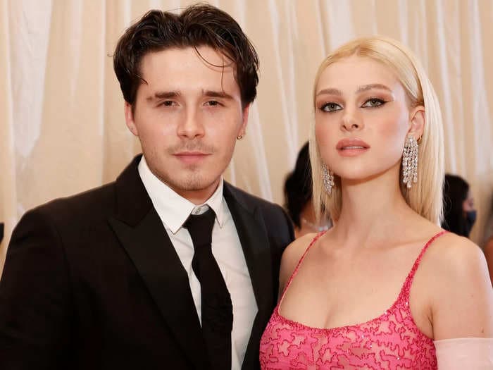 Nicola Peltz wore a custom Valentino wedding dress with her 'something blue' sewn into the skirt to marry Brooklyn Beckham