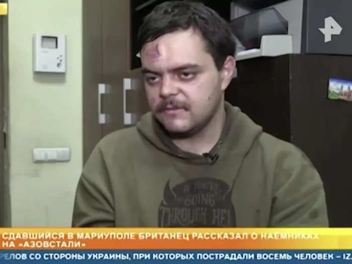 A British fighter captured in Ukraine by Russian forces appeared bloodied in an interview on state TV as he repeated Russian propaganda