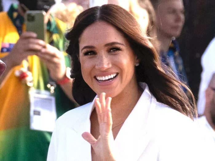 Meghan Markle made a splash at the Invictus Games in a white pantsuit and jewelry with a hidden meaning