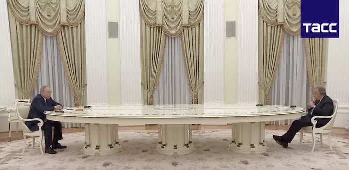 Putin breaks out the Kremlin's ridiculously long table to meet with the head of the UN