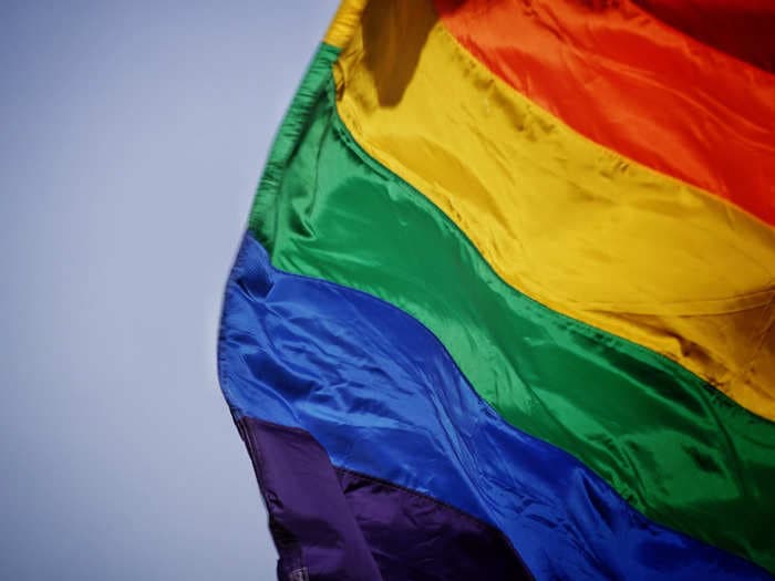 It was 'hard being gay' at BYU. But at graduation a student showed her 'true colors' by flashing a LGBTQ flag.