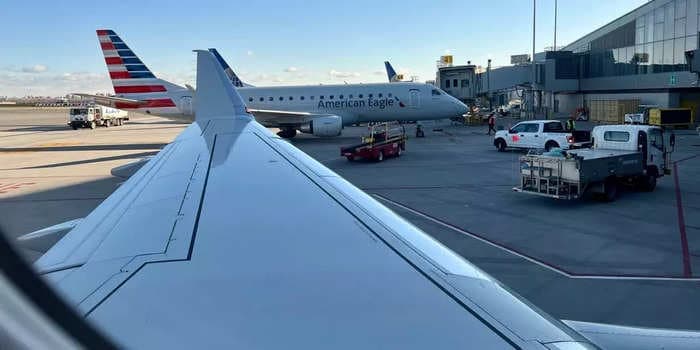 A United passenger was detained after opening the plane door and walking onto the wing while it was moving, police say