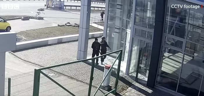 Security footage shows Russian troops shooting 2 Ukrainian civilians in the back, the BBC reports