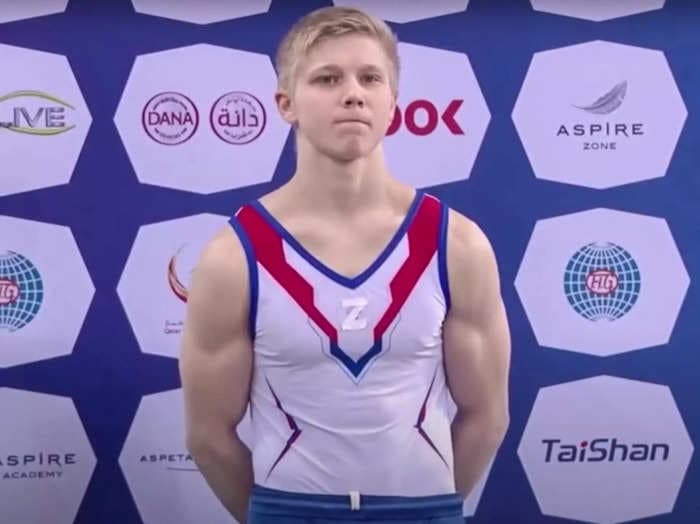 A Russian gymnast who wore pro-war 'Z' symbol at a competition has been barred for a year and ordered to return his medal