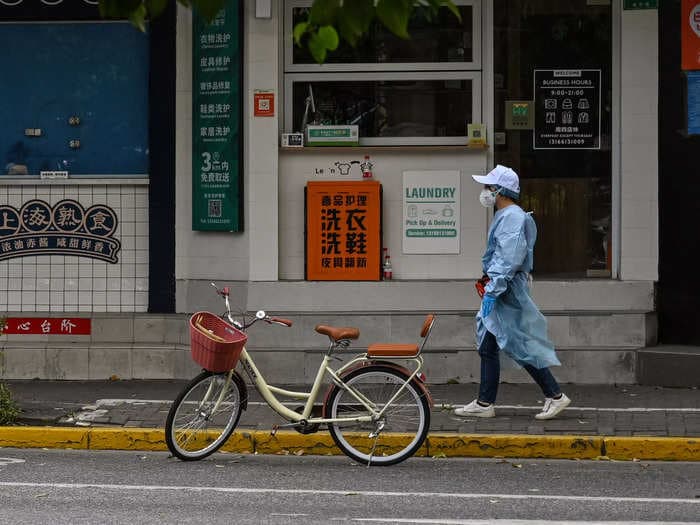 Locked-down factory workers at an Apple supplier in Shanghai stormed a dormitory housing company management, reports say