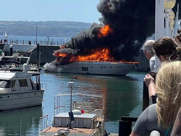 Photos, video show large yacht on fire in harbor of UK port
