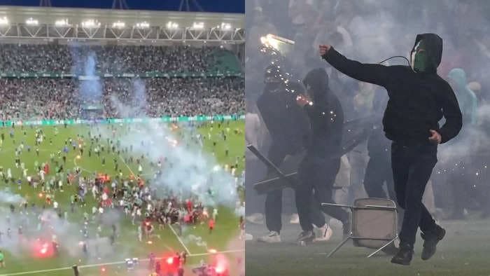 Fans of a French soccer team stormed the pitch and launched flares at its own players after the club was relegated from the top division