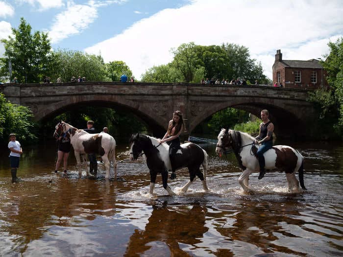 Photos of Europe's largest gathering of Romani and Traveler people as thousand enjoy the traditional horse-trading fair in a rural English town