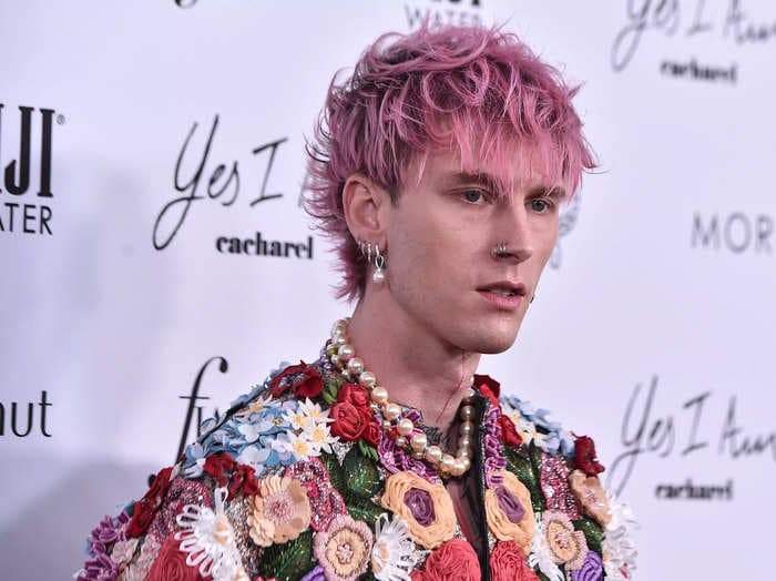 Machine Gun Kelly says he smashed a champagne glass on his forehead because he 'didn't have a fork' to 'clink' the glass