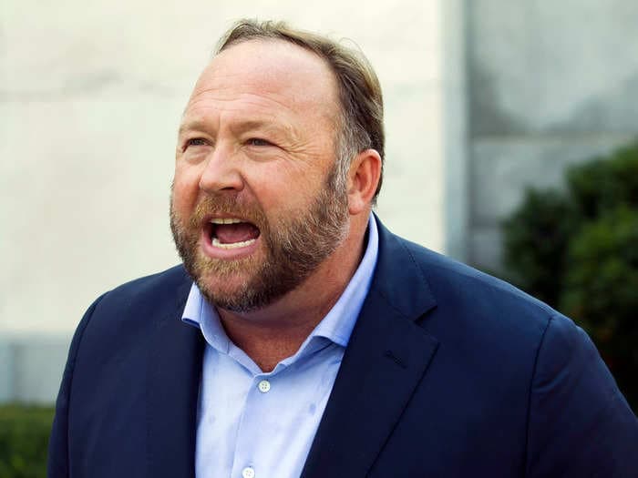 Sandy Hook dad calls Alex Jones a coward after the far-right conspiracy theorist didn't show up in court to hear his testimony