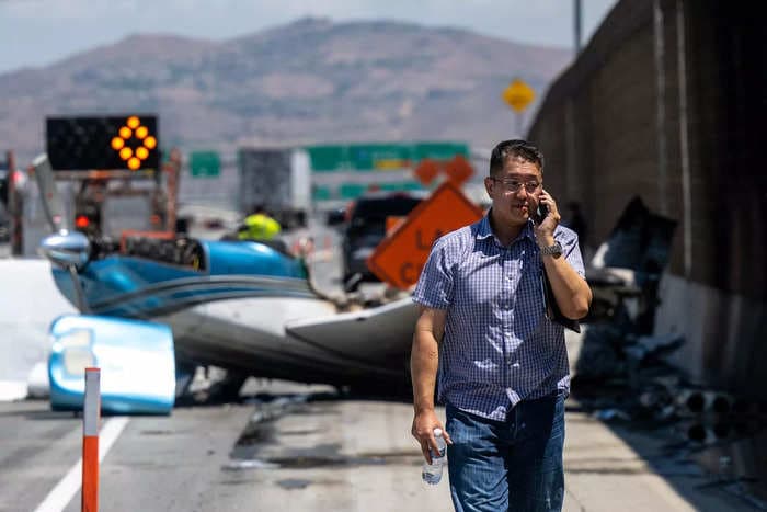 A small plane crash landed on a California freeway then burst into flames, just over a mile from an airport