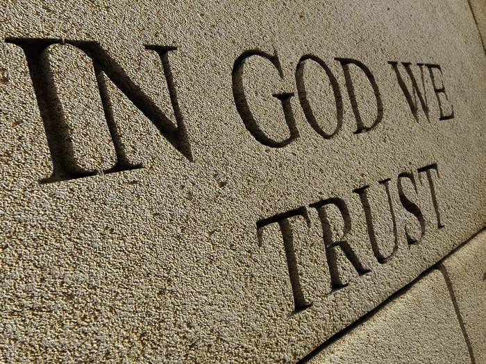 Texas schools are required to put up posters of the national motto 'In God We Trust,' but critics say the law imposes religion on children