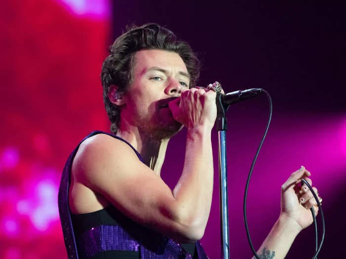Harry Styles denies that he's bald and says his producer is 'obsessed' with the rumor
