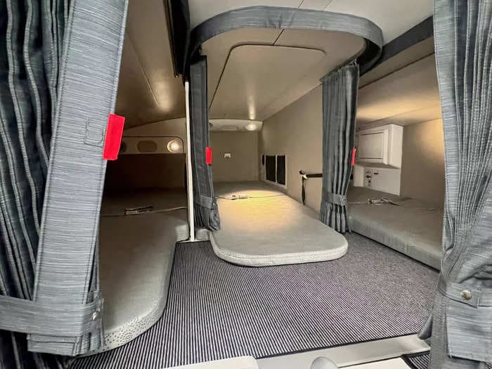 See inside the secret aircraft cabin where flight attendants sleep on long-haul journeys on an Airbus A350