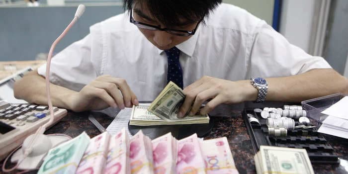 China's yuan tumbles near key threshold as dollar strength increases on aggressive Fed policy