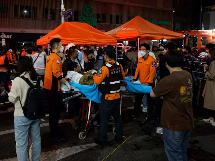 At least 151 dead and dozens injured after being crushed in a large crowd during Halloween festivities in South Korea: reports