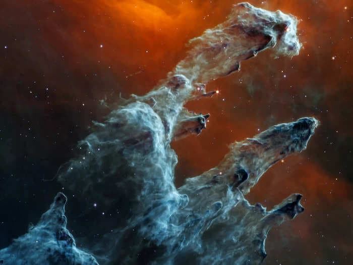 New infrared photos of the 'Pillars of Creation' from the James Webb Telescope reveal star-creating cosmic dust and massive galaxy clusters