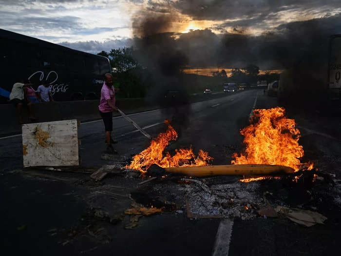 Bolsonaro supporters blockade Brazil's roads after he lost the election, demanding the result be overturned