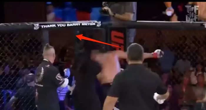 An MMA event descended into chaos when a fighter left the cage after his win and almost incited a riot