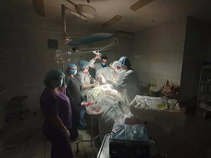 A Ukrainian surgeon had to operate using only a headlamp after a Russian missile strike plunged Lviv into darkness