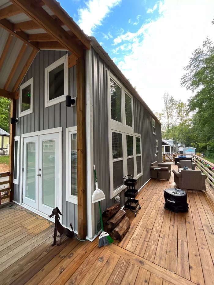 A 55-year-old traded in his corporate job and 3,500-square-foot house for a tiny home in a village at the foot of the Blue Ridge Mountains. Despite a post-move cancer diagnosis, he says he's never felt freer.