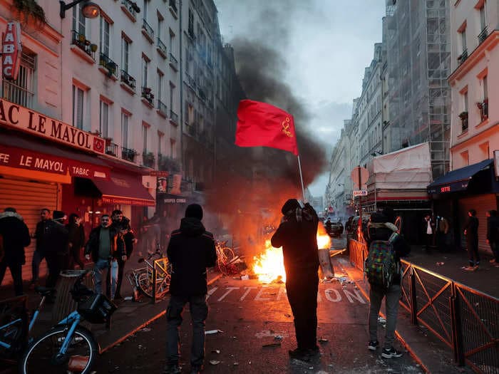 The suspect in a deadly shooting at a Kurdish cultural center in Paris was accused of attacking migrants in the city with a sword last year, French authorities say