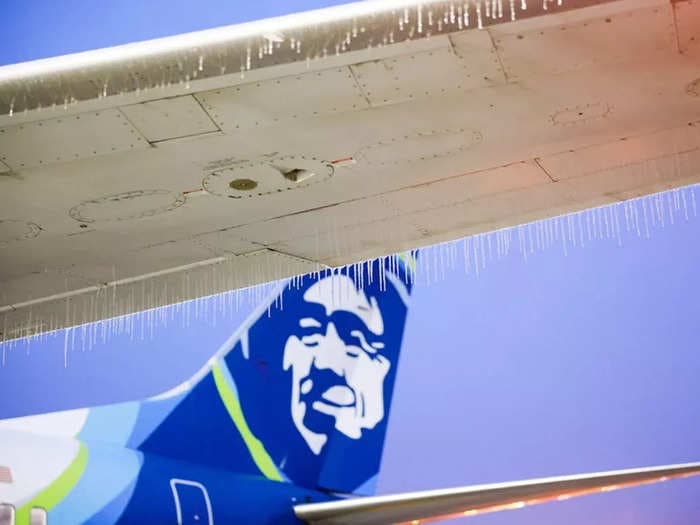 PHOTOS: Ice-coated planes end up stranded at airports after winter storm