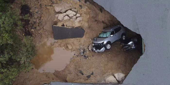 50 California firefighters had to pull people out of 2 cars that careened into a 15-foot sinkhole