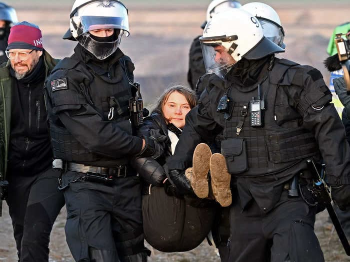 Video shows Greta Thunberg smiling as German police carry her away from a coal mine protest