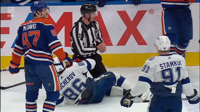 NHL on-ice official seriously injured when he got caught in the crossfire of a pair of cheap shots