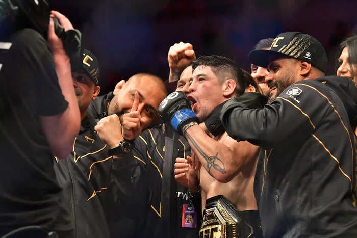 Angry fans hurled food, beer, and plastic cups at a UFC star. Security had to escort him out the arena.