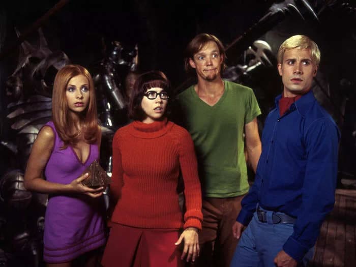 Sarah Michelle Gellar says 'Scooby-Doo' was originally 'less family-friendly,' but a 'steamy' kiss between Velma and Daphne and tease about Fred's sexuality were cut