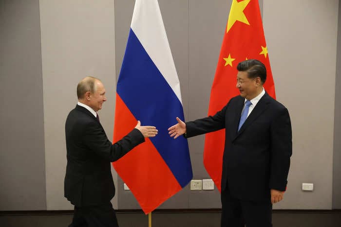 Russia is smashing open its $45 billion piggy bank of Chinese yuan as energy revenue crashes