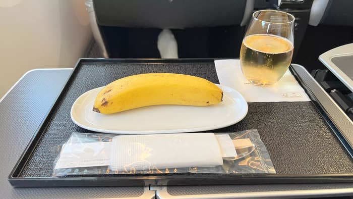 A business class airline passenger who ordered vegan food says it was insulting to be served one banana along with a pair of chopsticks