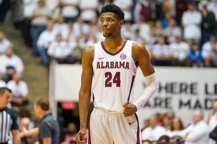 An Alabama basketball star received a mock pat-down from his teammate days after his involvement in a murder case came to light