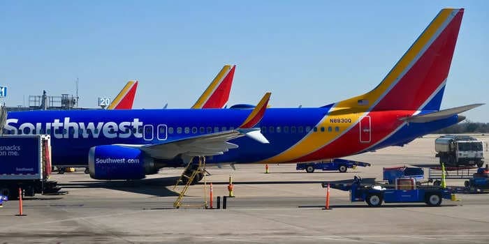 Southwest passengers describe people vomiting and passing out during aborted landing in heavy turbulence. They were then left at an empty terminal at another airport.