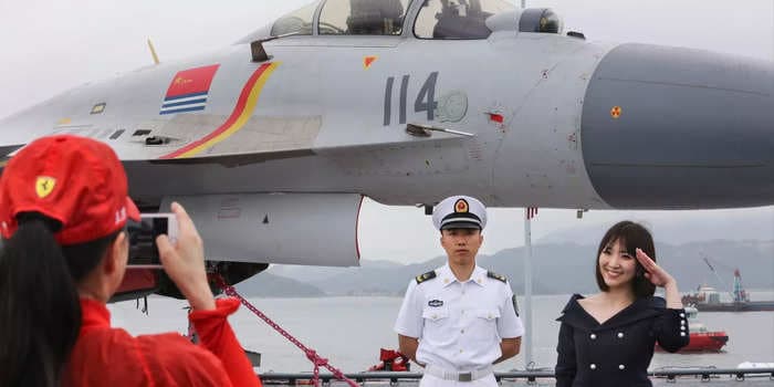 China is scrambling to find pilots to fly from its growing aircraft carrier fleet